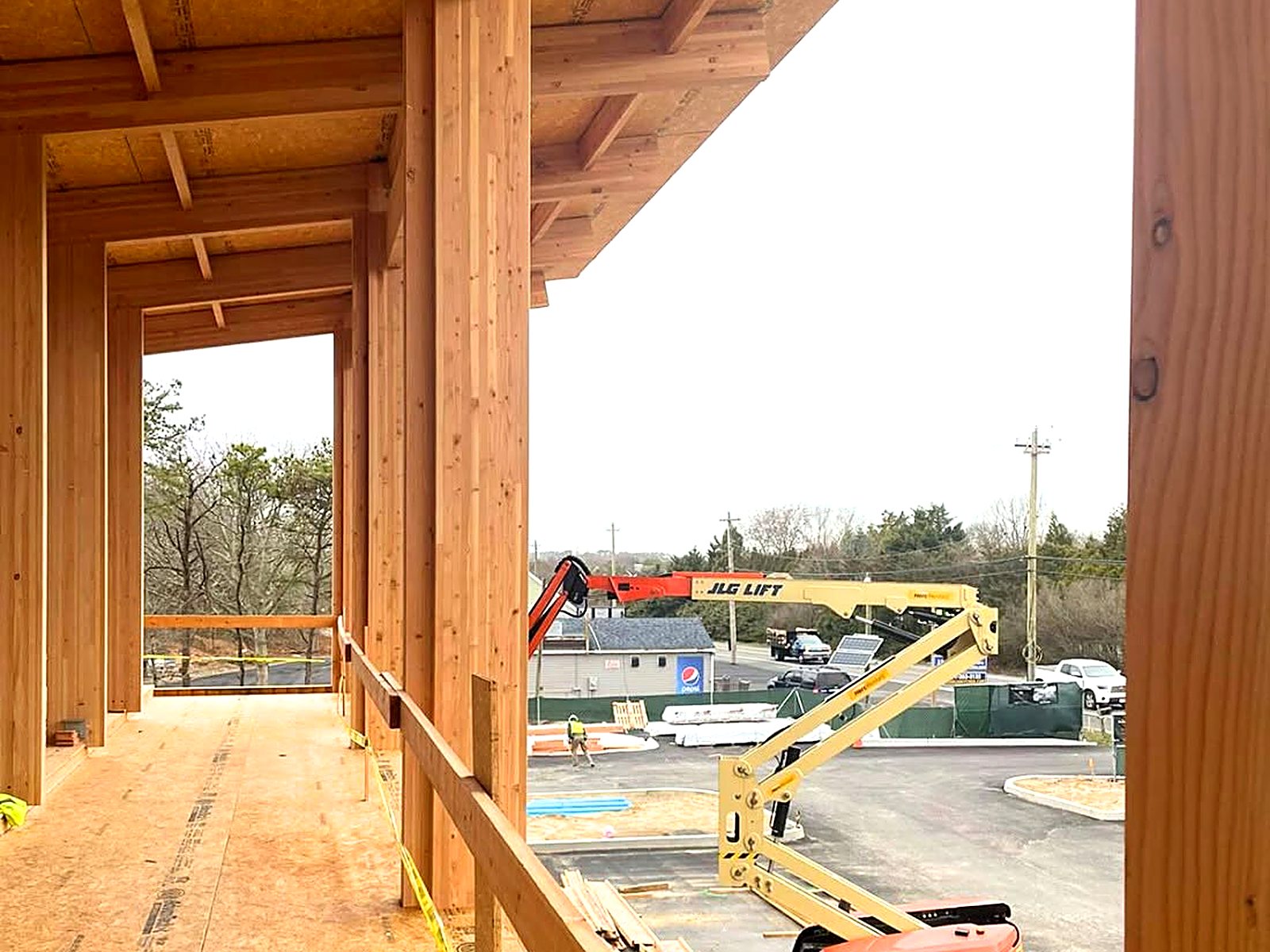 Framed walkway with timber columns and structural sheathing