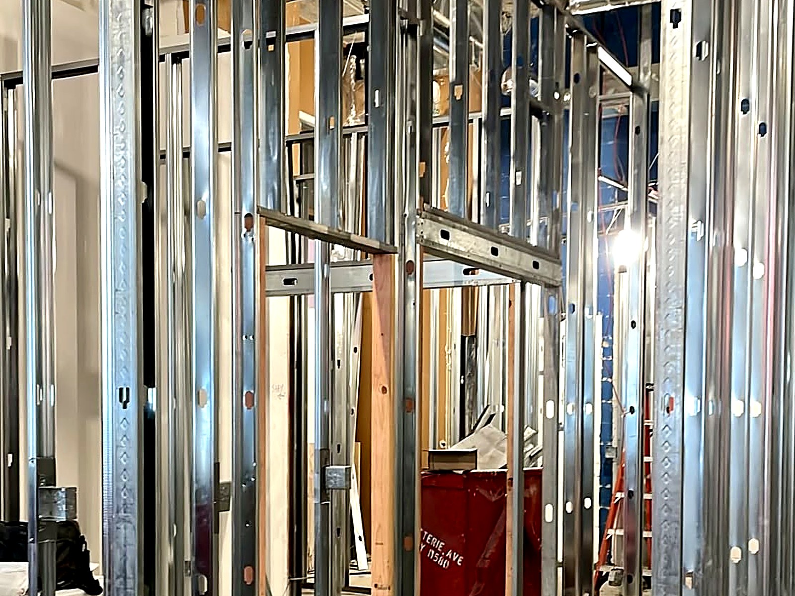 Metal stud partitions and framed door openings in a commercial fit-out