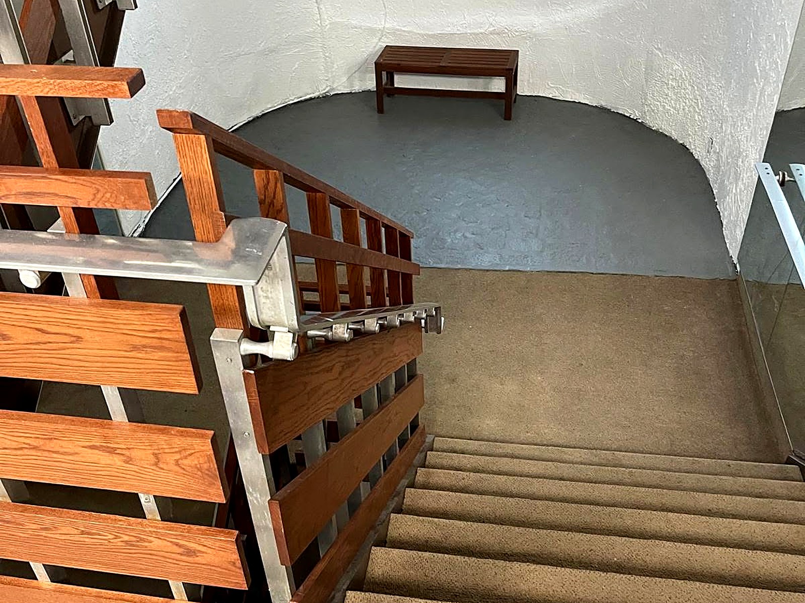Interior stair and wood slat guardrail renovation with new plank flooring