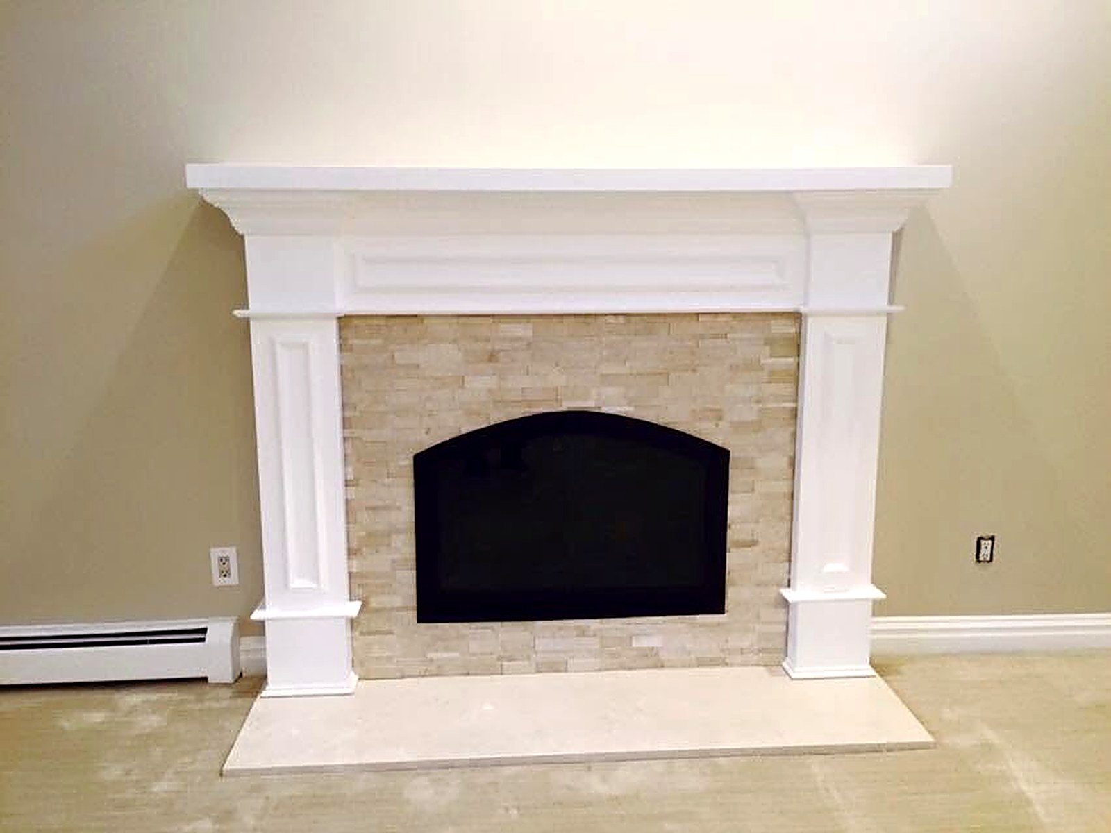 Painted fireplace mantel and millwork detail with clean cut lines