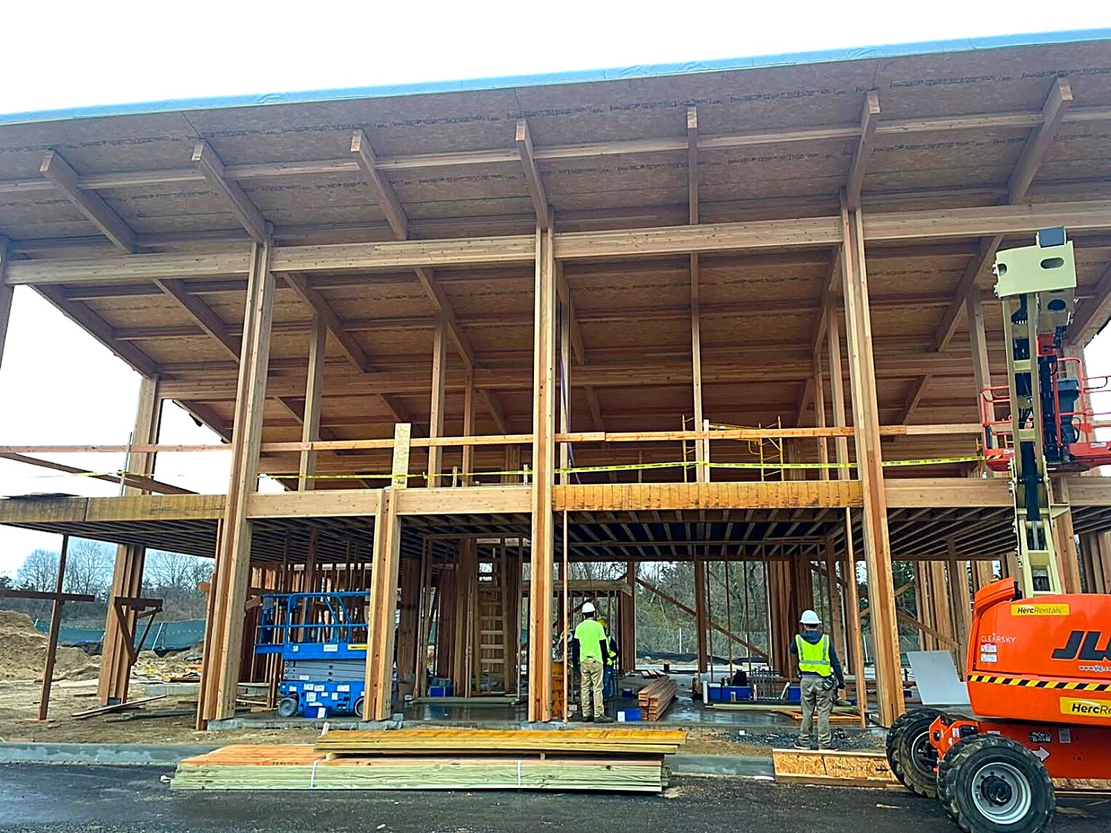 Heavy timber post-and-beam frame under construction on a commercial building