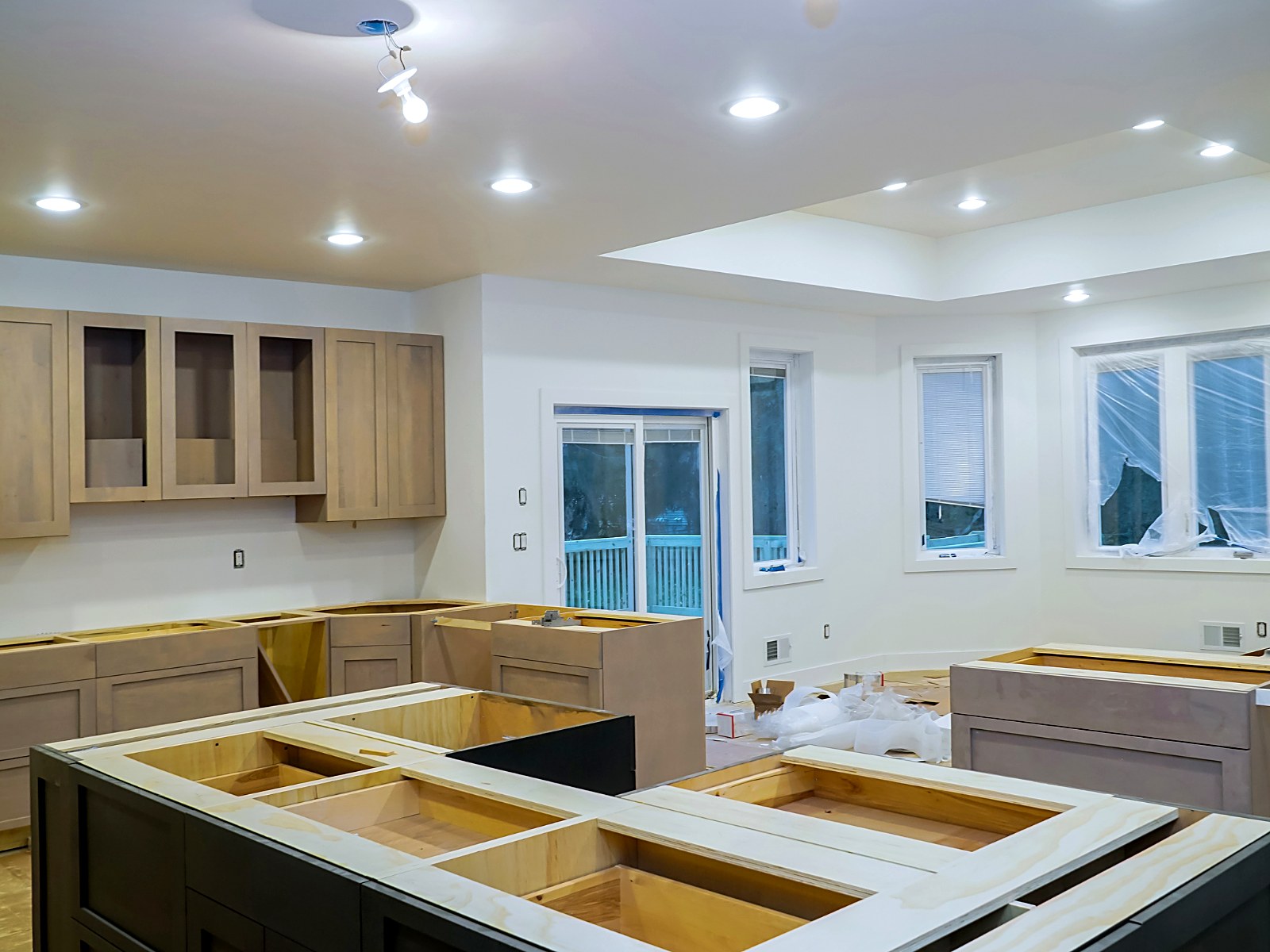 Kitchen remodel in progress with new cabinetry and island boxes set