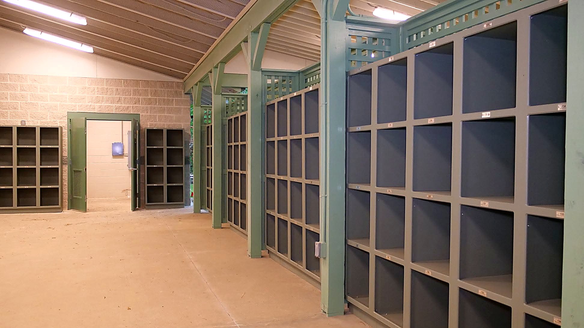 Painted millwork cubby units and lattice trim panels in a park pavilion