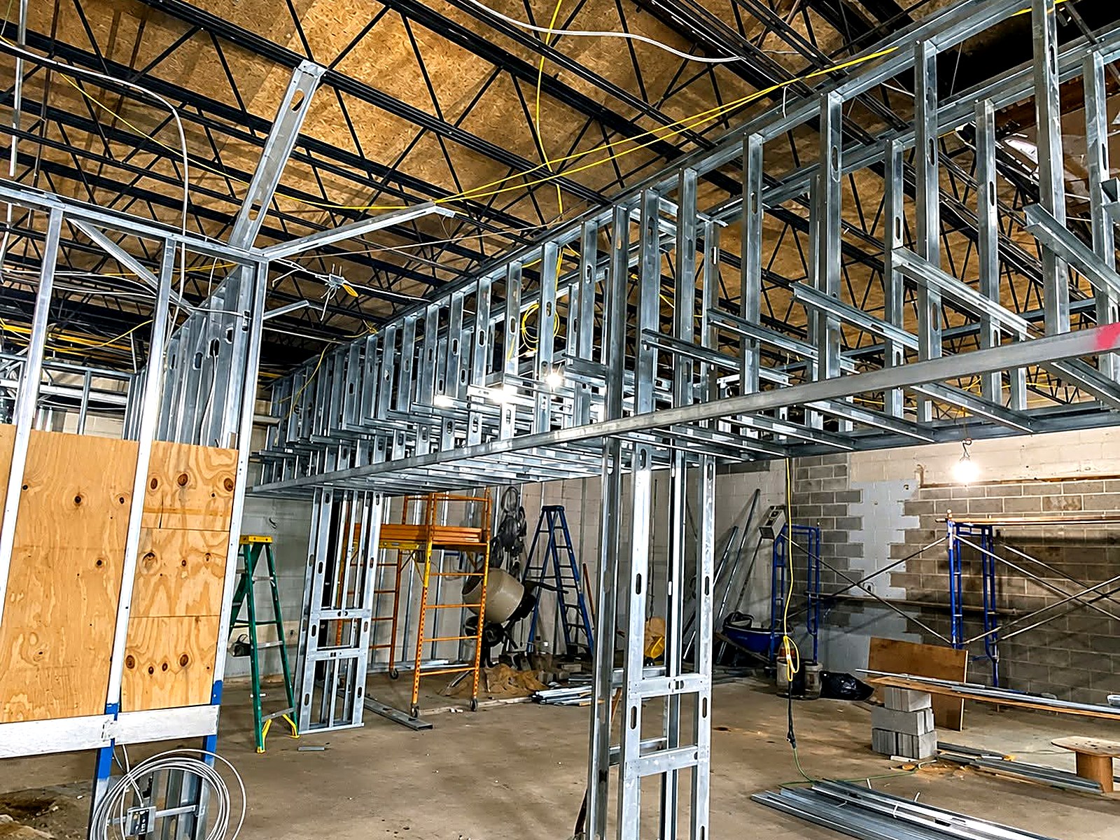 Wide open floor plate framed out with metal stud walls and soffits