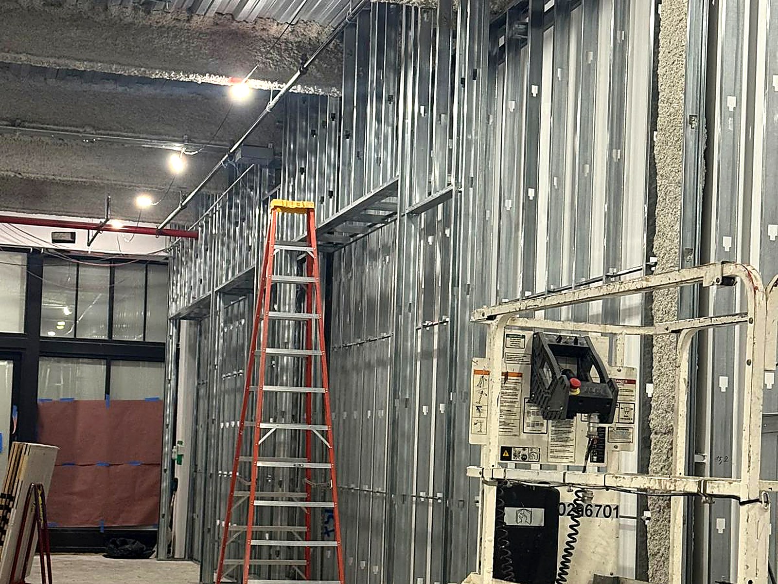 Long run of metal stud wall framing along a commercial perimeter