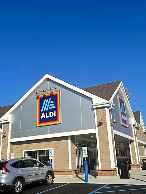 ALDI supermarket exterior with completed facade and entry canopy