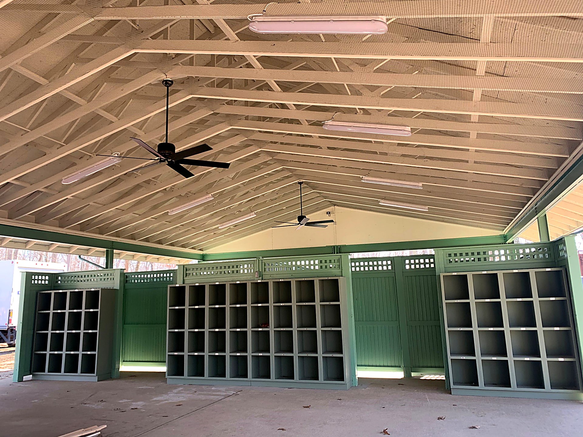 Open-air pavilion with custom cubby casework and painted trim woodwork